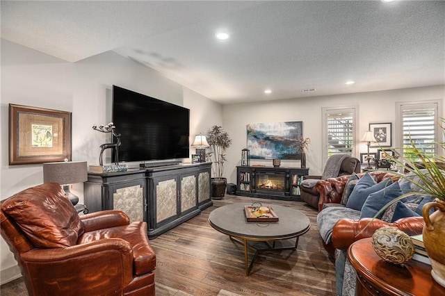 15278 W 173rd St, Olathe, KS 66062 - living area with hardwood / wood-style floors, recessed lighting, and a glass covered fireplace