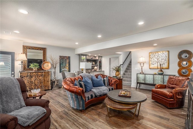 15278 W 173rd St, Olathe, KS 66062 - living area featuring stairway, wood finished floors, and recessed lighting