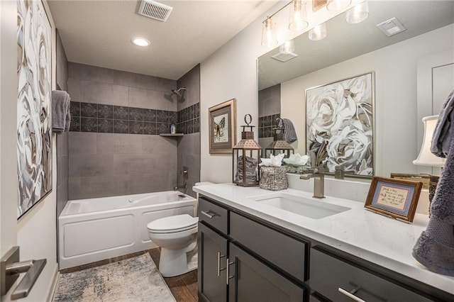 15278 W 173rd St, Olathe, KS 66062 - full bathroom featuring vanity, shower / bathtub combination, wood finished floors, and recessed lighting