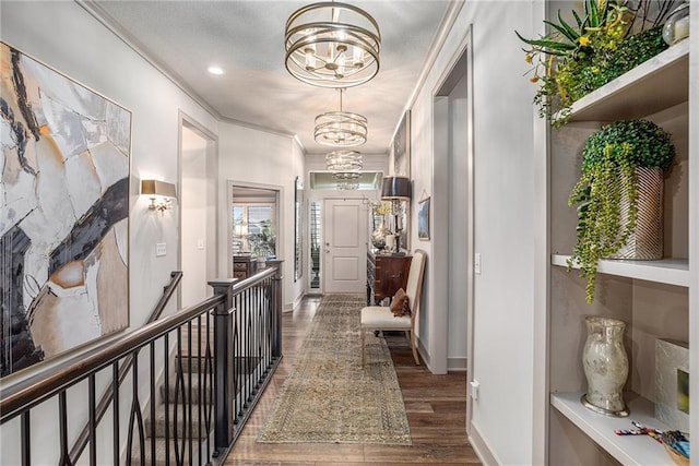 15278 W 173rd St, Olathe, KS 66062 - hallway featuring a chandelier, wood finished floors, crown molding, an upstairs landing, and recessed lighting