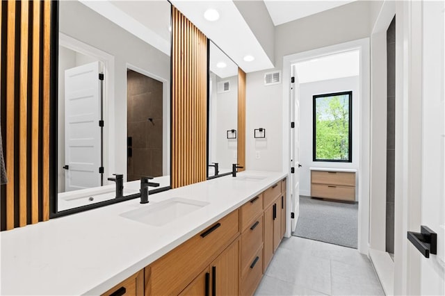 6111 Persimmon Ct, Parkville, MO 64152 - bathroom featuring double vanity, recessed lighting, tile patterned floors, and tiled shower