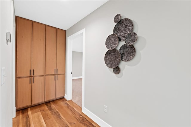 6111 Persimmon Ct, Parkville, MO 64152 - detailed view of wood finished floors and baseboards