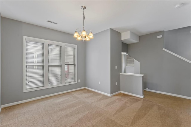 5245 Overland Dr, Lawrence, KS 66049 - unfurnished room with a chandelier, carpet, baseboards, and a smoke detector