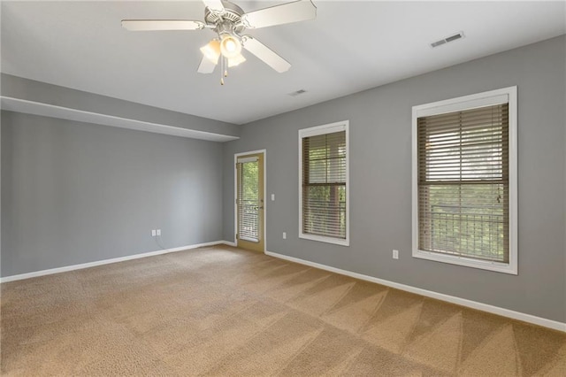 5245 Overland Dr, Lawrence, KS 66049 - spare room featuring baseboards, carpet floors, and a ceiling fan