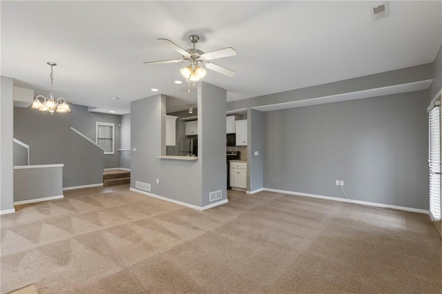 5245 Overland Dr, Lawrence, KS 66049 - unfurnished living room with a ceiling fan, light colored carpet, baseboards, and recessed lighting
