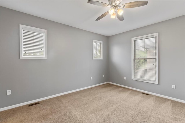 5245 Overland Dr, Lawrence, KS 66049 - carpeted spare room featuring a ceiling fan and baseboards