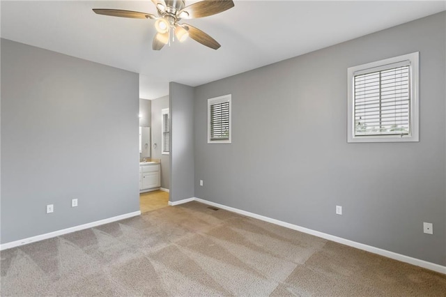 5245 Overland Dr, Lawrence, KS 66049 - carpeted empty room with a ceiling fan and baseboards