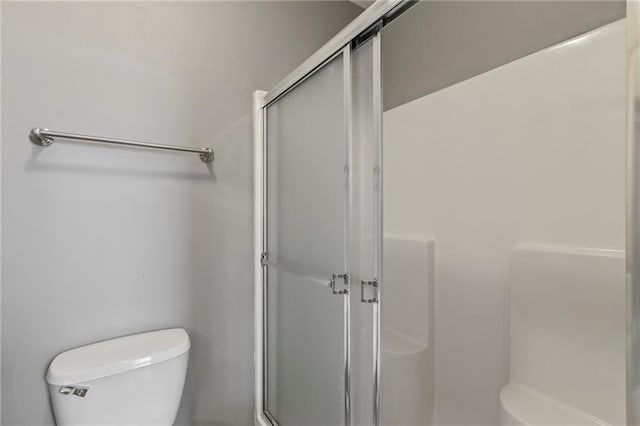 5245 Overland Dr, Lawrence, KS 66049 - bathroom with a shower with shower door and toilet