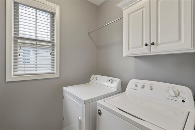 5245 Overland Dr, Lawrence, KS 66049 - washroom featuring washing machine and dryer and cabinet space