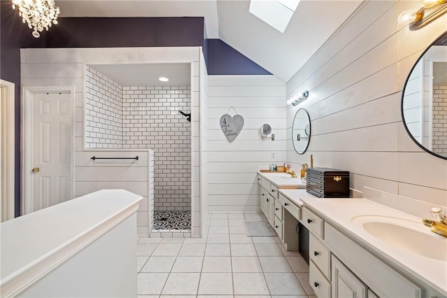 15998 Overbrook Ln, Overland Park, KS 66224 - full bath featuring tile patterned floors, walk in shower, vaulted ceiling, double vanity, and a skylight
