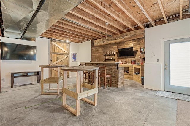 15998 Overbrook Ln, Overland Park, KS 66224 - bar area featuring unfinished concrete flooring and a barn door