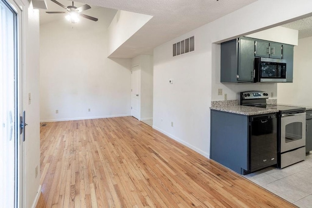 255 N Michigan St Unit 1-2, Lawrence, KS 66044 - kitchen with appliances with stainless steel finishes, ceiling fan, light wood-style flooring, baseboards, and open floor plan