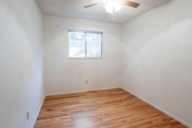 255 N Michigan St Unit 1-2, Lawrence, KS 66044 - spare room featuring light wood-style flooring, ceiling fan, a textured ceiling, and baseboards