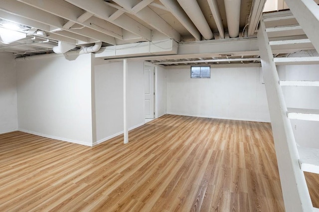 255 N Michigan St Unit 1-2, Lawrence, KS 66044 - finished below grade area featuring wood finished floors and baseboards