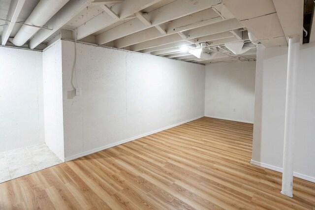 255 N Michigan St Unit 1-2, Lawrence, KS 66044 - finished basement featuring wood finished floors and baseboards