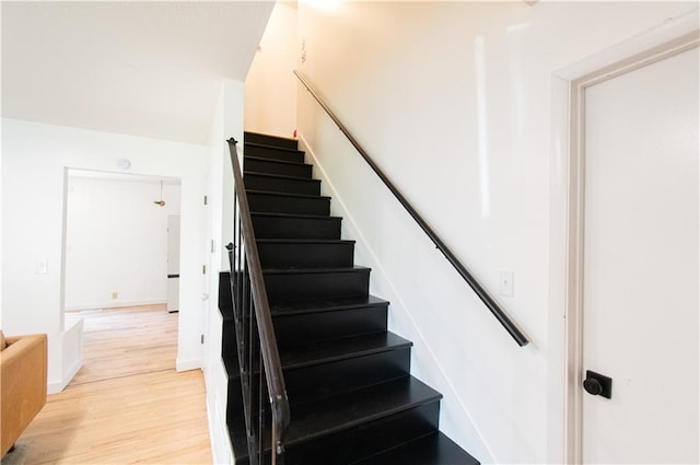 1739 W 26th St, Lawrence, KS 66047 - stairway featuring wood finished floors