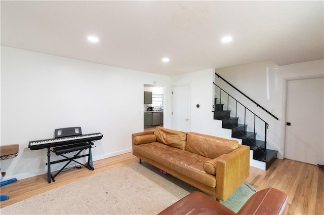 1739 W 26th St, Lawrence, KS 66047 - living area featuring light wood-style floors, stairs, and recessed lighting