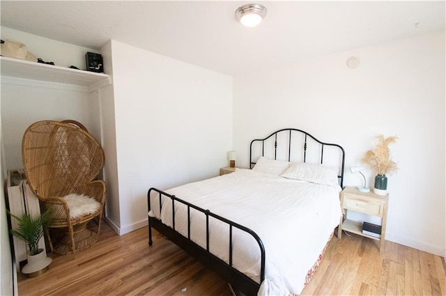1739 W 26th St, Lawrence, KS 66047 - bedroom with light wood-style flooring and baseboards