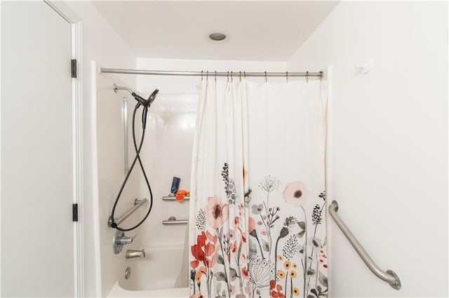 1739 W 26th St, Lawrence, KS 66047 - bathroom with shower / bath combo with shower curtain