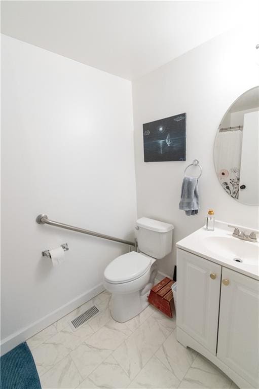 1739 W 26th St, Lawrence, KS 66047 - bathroom featuring marble look tiles and vanity