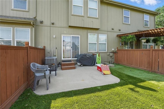 207 N Laurel St Unit 5D, Gardner, KS 66030 - rear view of property with a patio area and a fenced backyard