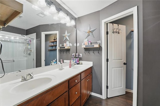 207 N Laurel St Unit 5D, Gardner, KS 66030 - bathroom with double vanity, a stall shower, and wood finished floors