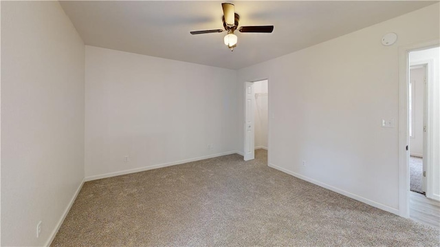 118 W Hickory St, Nevada, MO 64772 - empty room featuring carpet floors and a ceiling fan