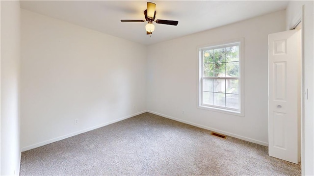 118 W Hickory St, Nevada, MO 64772 - unfurnished room with carpet floors and ceiling fan