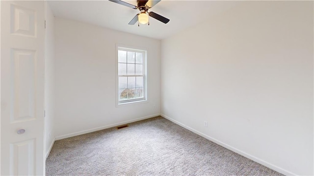 118 W Hickory St, Nevada, MO 64772 - unfurnished room with carpet floors and a ceiling fan