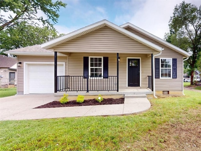 118 W Hickory St, Nevada, MO 64772 - view of front of house featuring a porch, concrete driveway, a garage, a front lawn, and crawl space