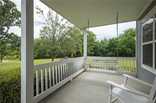 35705 E Rd Mize Rd, Oak Grove, MO 64075 - covered porch with view of scattered trees