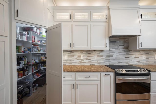 35705 E Rd Mize Rd, Oak Grove, MO 64075 - kitchen featuring stainless steel electric range, custom exhaust hood, white cabinets, and dark stone counters