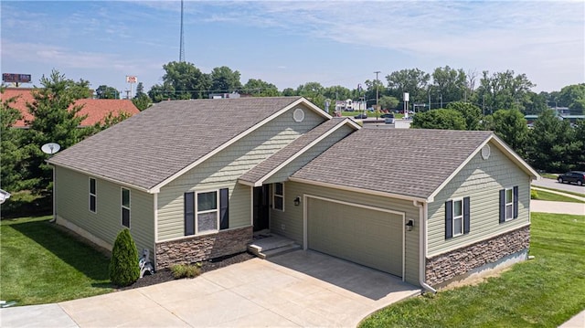 3206 Sheffield Ln, Saint Joseph, MO 64506 - ranch-style home featuring stone siding, a garage, driveway, a front yard, and roof with shingles
