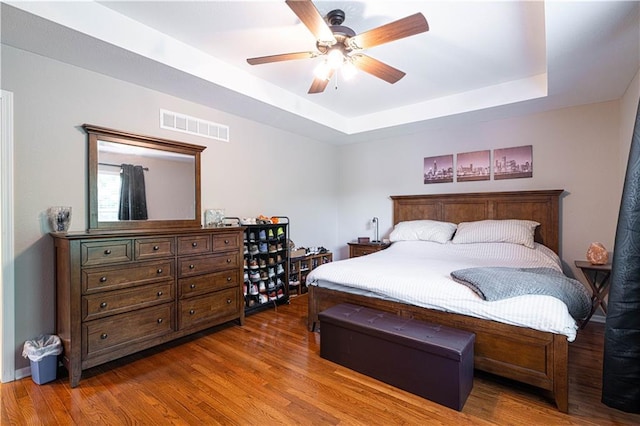 3206 Sheffield Ln, Saint Joseph, MO 64506 - bedroom with wood finished floors, a raised ceiling, and a ceiling fan