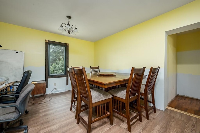 4207 10th Ave, Leavenworth, KS 66048 - dining space featuring light wood finished floors, a chandelier, and an office area
