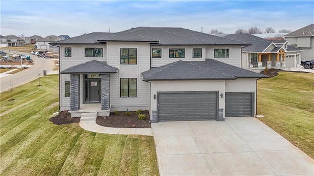 6018 Arapahoe St, Shawnee, KS 66226 - prairie-style house featuring concrete driveway, a shingled roof, a front lawn, a garage, and a residential view