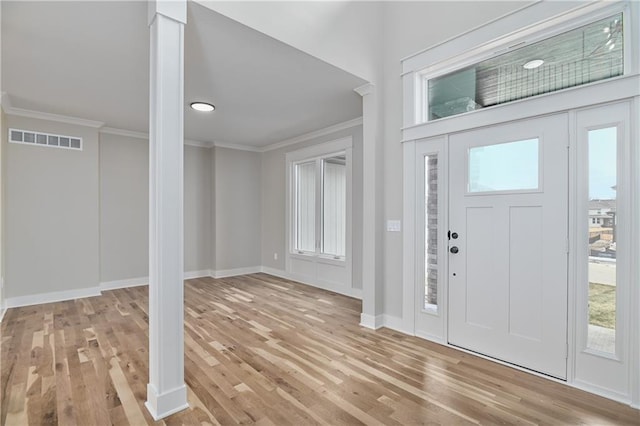 6018 Arapahoe St, Shawnee, KS 66226 - foyer with ornamental molding, wood finished floors, and baseboards