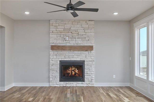 6018 Arapahoe St, Shawnee, KS 66226 - detailed view of wood finished floors, ceiling fan, a fireplace, baseboards, and recessed lighting