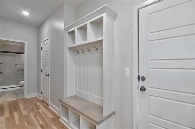 6018 Arapahoe St, Shawnee, KS 66226 - mudroom featuring light wood-style floors and baseboards
