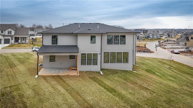 6018 Arapahoe St, Shawnee, KS 66226 - rear view of house with a patio area, roof with shingles, a residential view, and a yard