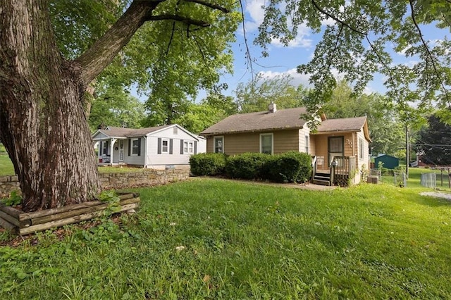 506 Hereford Ave, Independence, MO 64055 - back of house with a lawn