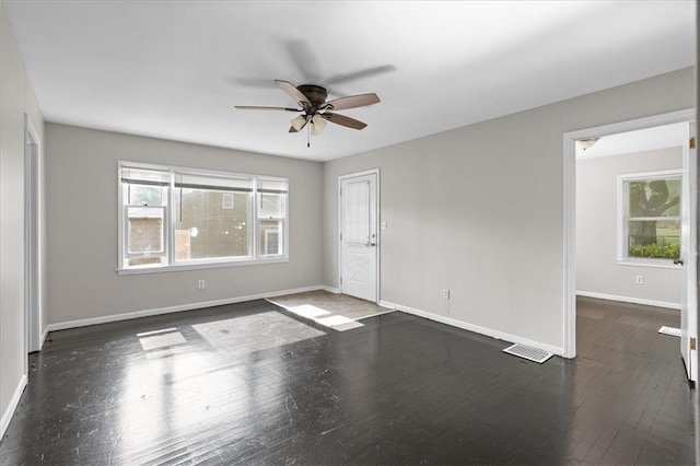 506 Hereford Ave, Independence, MO 64055 - unfurnished room featuring healthy amount of natural light, ceiling fan, baseboards, and hardwood / wood-style flooring