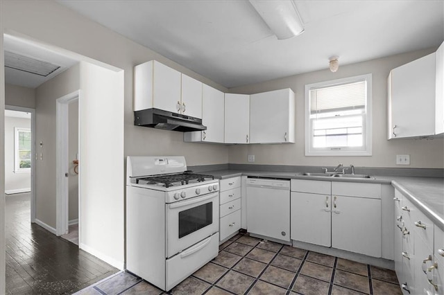 506 Hereford Ave, Independence, MO 64055 - kitchen featuring white appliances, under cabinet range hood, healthy amount of natural light, and white cabinets