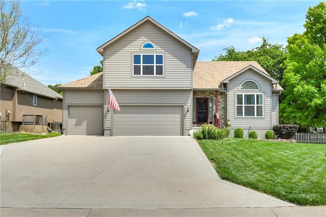 4316 Grand Ave, Leavenworth, KS 66048 - traditional-style house featuring concrete driveway, roof with shingles, and a garage