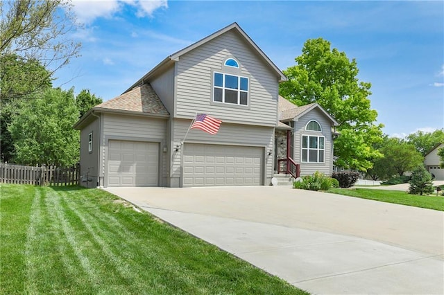 4316 Grand Ave, Leavenworth, KS 66048 - traditional-style house with concrete driveway, an attached garage, and a shingled roof