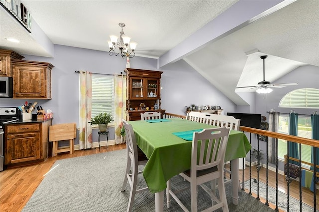 4316 Grand Ave, Leavenworth, KS 66048 - dining room featuring a chandelier, light wood-style flooring, and ceiling fan