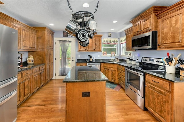 4316 Grand Ave, Leavenworth, KS 66048 - kitchen with stainless steel appliances, a sink, a kitchen island, plenty of natural light, and recessed lighting