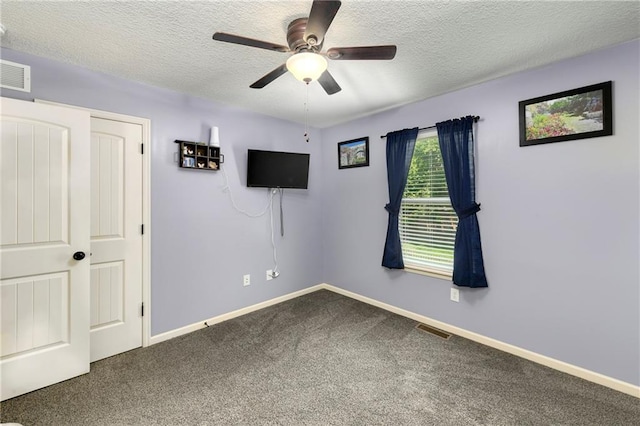 4316 Grand Ave, Leavenworth, KS 66048 - unfurnished bedroom with a textured ceiling, carpet flooring, baseboards, and a ceiling fan