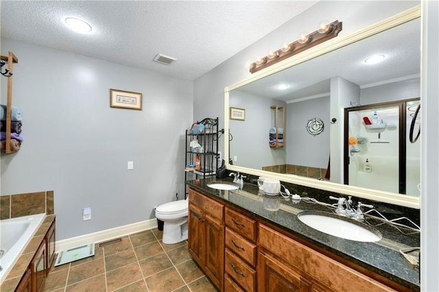 4316 Grand Ave, Leavenworth, KS 66048 - bathroom featuring a bath, double vanity, toilet, a shower stall, and a textured ceiling