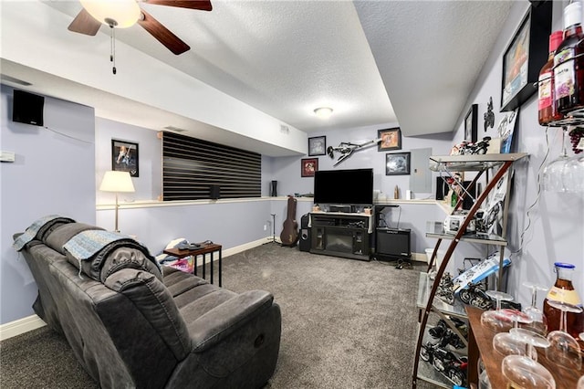 4316 Grand Ave, Leavenworth, KS 66048 - living area featuring carpet floors, a textured ceiling, baseboards, and ceiling fan